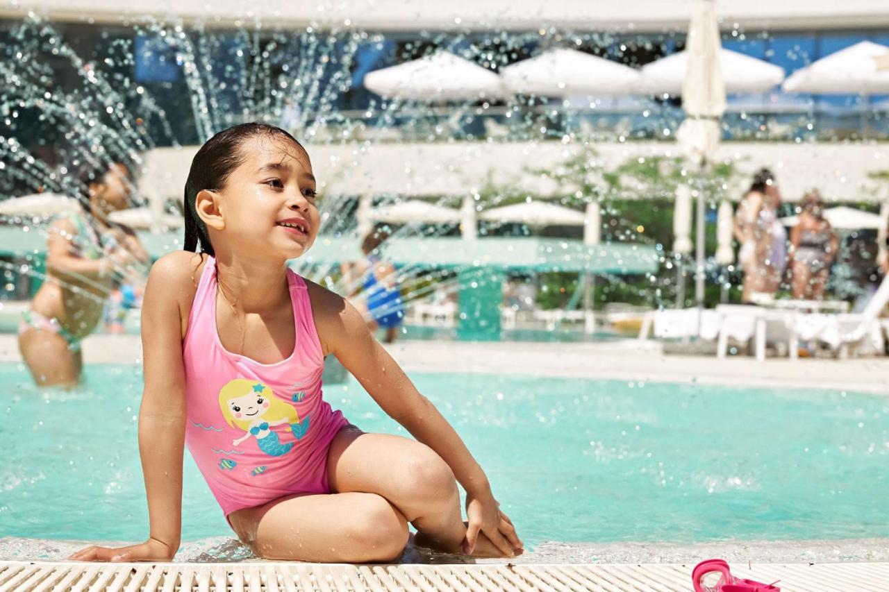 Sheraton Dubrovnik Riviera Hotel Mlini Exterior photo A girl wearing a swimsuit